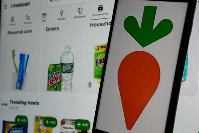 An instacart logo and an instacart webpage are shown in this photo, in New York, Wednesday, Sept. 6, 2023. (AP Photo/Richard Drew)