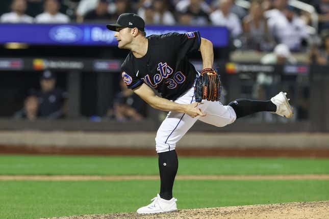 Jun 13, 2023; New York City, New York, USA; New York Mets relief pitcher David Robertson (30) delivers a pitch  during the ninth inning against the New York Yankees at Citi Field.