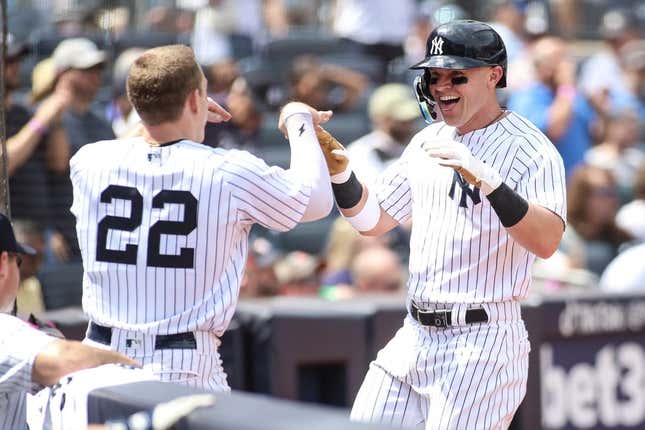 Aug 5, 2023; Bronx, New York, USA;  New York Yankees first baseman Jake Bauers (61) is greeted by center fielder Harrison Bader (22) after hitting a solo home run in the fifth inning against the Houston Astros at Yankee Stadium.