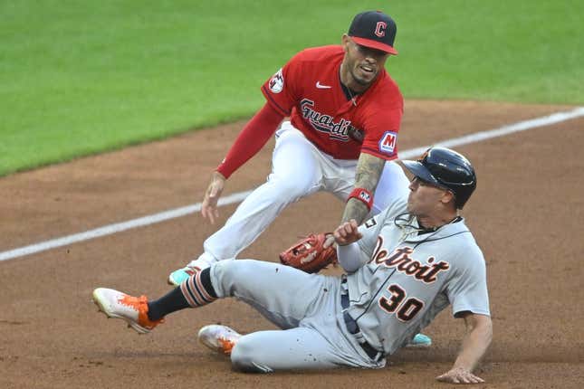 Aug 18, 2023; Cleveland, Ohio, USA; Detroit Tigers right fielder Kerry Carpenter (30) is tagged out by Cleveland Guardians third baseman Gabriel Arias (13) in the second inning at Progressive Field.