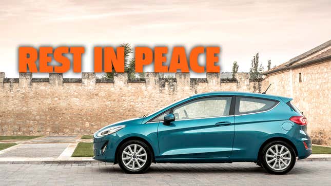 A photo of a blue Ford Fiesta hatchback with the caption "rest in peace" 