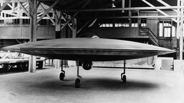 A 3/5 scale model of a proposed VTOL ‘flying saucer’ aircraft, the Couzinet Aerodyne RC-360, on display at a workshop on the Ile de la Jatte in Levallois-Perret, Paris, 1955.