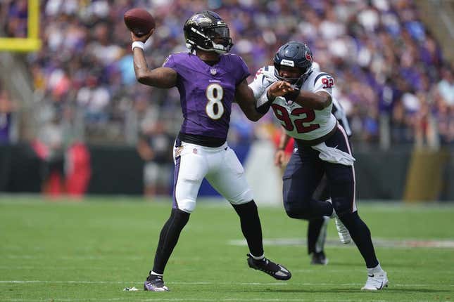 Sep 10, 2023; Baltimore, Maryland, USA; Baltimore Ravens quarterback Lamar Jackson (8) pressured by Houston Texans defensive end Dylan Horton (92) in the first quarter at M&amp;amp;T Bank Stadium.