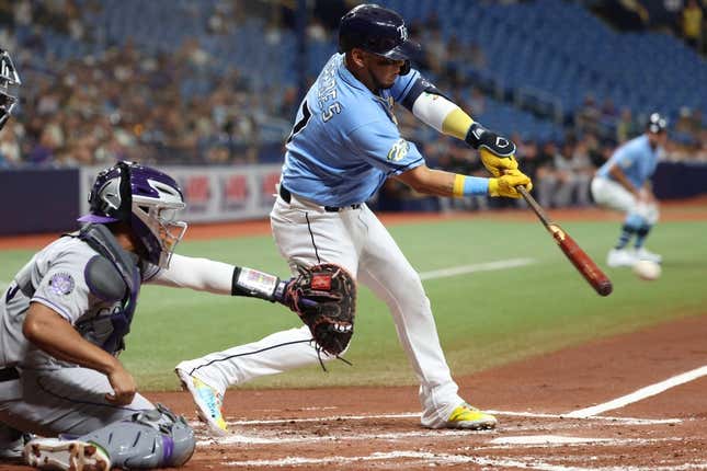Aug 22, 2023; St. Petersburg, Florida, USA; Tampa Bay Rays third baseman Isaac Paredes (17) hits a sacrifice RBI against the Colorado Rockies during the first inning at Tropicana Field.