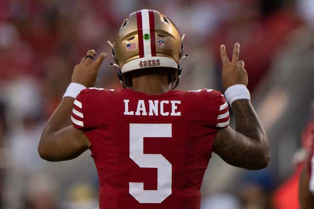 Aug 19, 2023; Santa Clara, California, USA;  San Francisco 49ers quarterback Trey Lance (5) signals during the third quarter against the Denver Broncos at Levi&#39;s Stadium.