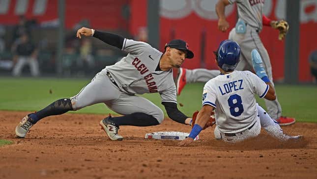 Jun 27, 2023; Kansas City, Missouri, USA;  Cleveland Guardians second baseman Andres Gimenez (0) tags out Kansas City Royals Nicky Lopez (8) attempting to steal second base in the third inning at Kauffman Stadium.