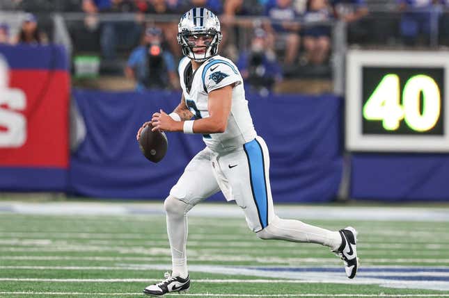 Aug 18, 2023; East Rutherford, New Jersey, USA; Carolina Panthers quarterback Matt Corral (2) scrambles during the second half against the New York Giants at MetLife Stadium.