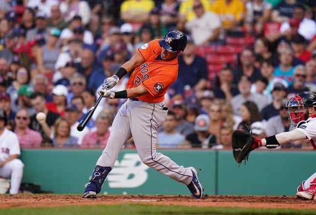 Aug 30, 2023; Boston, Massachusetts, USA; Houston Astros designated hitter Michael Brantley (23) hits a single to right field to drive in two runs against the Boston Red Sox in the third inning at Fenway Park.