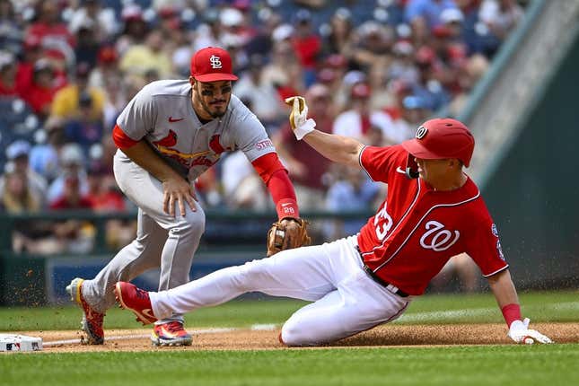 Jun 19, 2023; Washington, District of Columbia, USA; St. Louis Cardinals third baseman Nolan Arenado (28) tags out Washington Nationals left fielder Corey Dickerson (23) to end the first inning at Nationals Park.