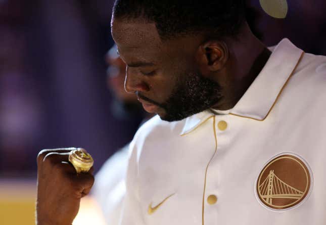SAN FRANCISCO, CALIFORNIA - OCTOBER 18: Draymond Green #23 of the Golden State Warriors inspects his championship ring during a ceremony prior to the game against the Los Angeles Lakers at Chase Center on October 18, 2022, in San Francisco, California.