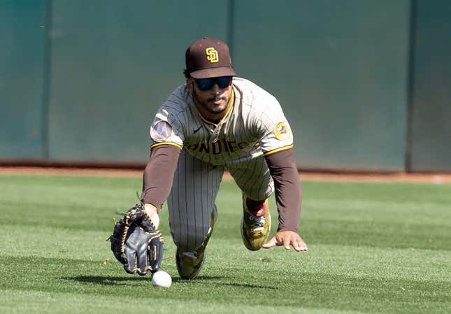 Sep 16, 2023; Oakland, California, USA; San Diego Padres center fielder Trent Grisham (1) misses a catch hit by Oakland Athletics center fielder Lawrence Butler during the fourth inning at Oakland-Alameda County Coliseum.