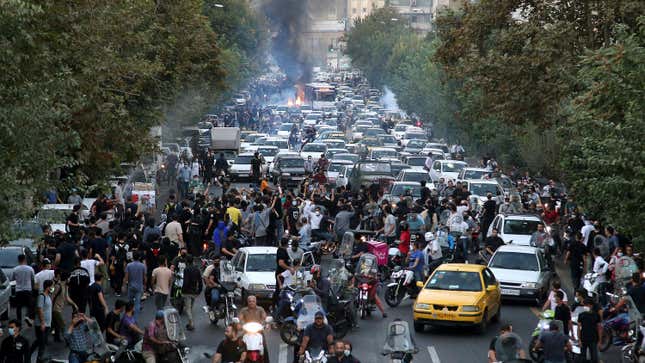 In this Sept. 21, 2022 photo taken by an individual not  employed by the Associated Press and obtained by the AP outside Iran,  protesters chant slogans during a protest over the death of a woman who  was detained by the morality police in downtown Tehran, Iran.