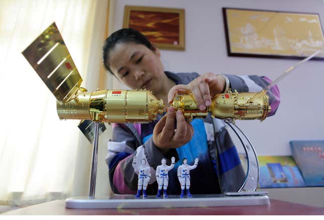 A model of the Shenzhou-9, right, shown with a model of the Tiangong-1 at a shop at China’s Jiuquan Satellite Launch Centre.