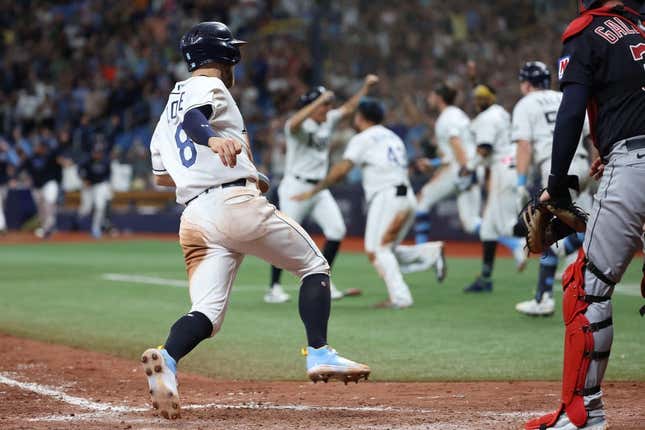 Aug 12, 2023; St. Petersburg, Florida, USA;  Tampa Bay Rays second baseman Brandon Lowe (8) scores the game winning run against the Cleveland Guardians during the ninth inning at Tropicana Field.