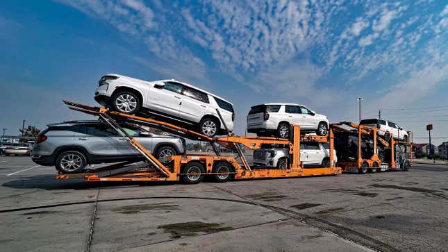 A week before a possible UAW strike, a car transport tractor trailer truck with a mixed load of new Chevy and GMC SUVs on board that were just made at the plant in Arlington Texas on route to a dealership in Nebraska sits parked in Walmart parking lot while driver takes mandatory rest