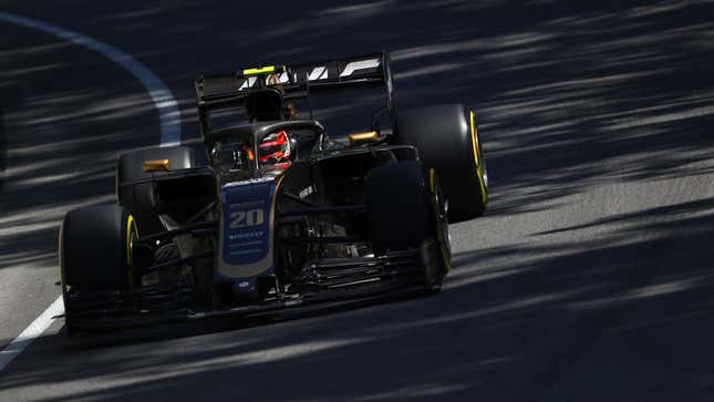 A photo of the black and gold F1 car of the Haas team. 