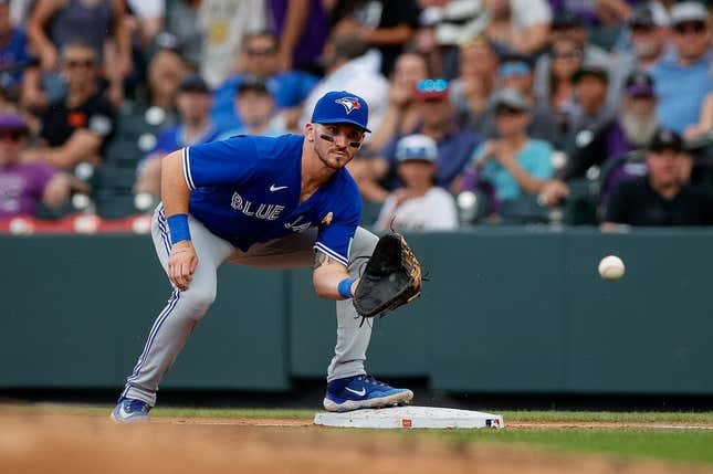 Sep 3, 2023; Denver, Colorado, USA; Toronto Blue Jays first baseman Spencer Horwitz (48) fields a throw to first in the fourth inning against the Colorado Rockies at Coors Field.
