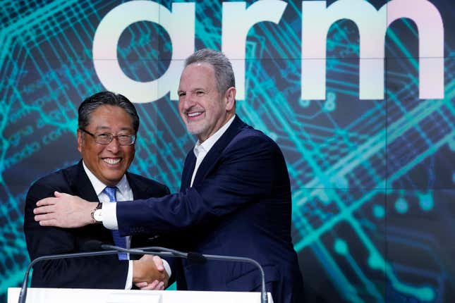 ARM Holdings CEO Rene Haas, right, and Softbank CFO Yoshimitsu Goto shake hands at the Nasdaq MarketSite, during the ARM Holdings IPO, in New York&#39;s Times Square, Thursday, Sept. 14, 2023. (AP Photo/Richard Drew)