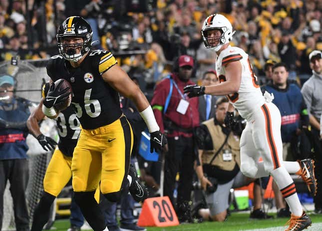 Sep 18, 2023; Pittsburgh, Pennsylvania, USA;  Pittsburgh Steelers linebacker Alex Highsmith (56) returns an interception for a touchdown as Cleveland Browns wide receiver Harrison Bryant (88) watches the score at Acrisure Stadium.