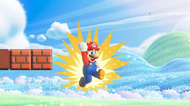 Mario leaps in the air next to some bricks.