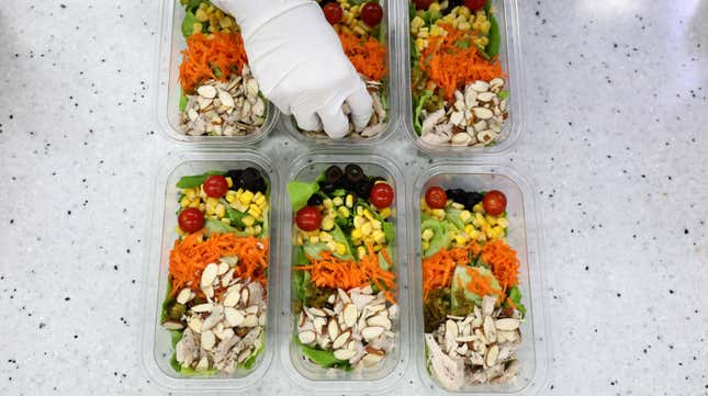 An employee of Farm8 makes a salad at a Metro Farm inside Sangdo metro station on April 22, 2021 in Seoul, South Korea.
