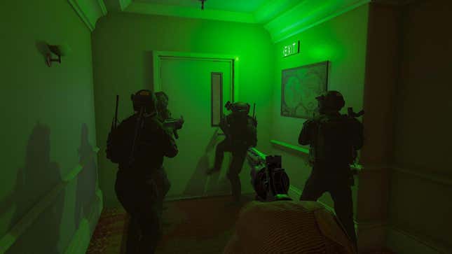 SWAT officers prepare to breach a room lit by green light.