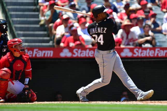 Jun 29, 2023; Anaheim, California, USA; Chicago White Sox right fielder Eloy Jimenez (74) hits a two run RBI single against the Los Angeles Angels during the third inning at Angel Stadium.