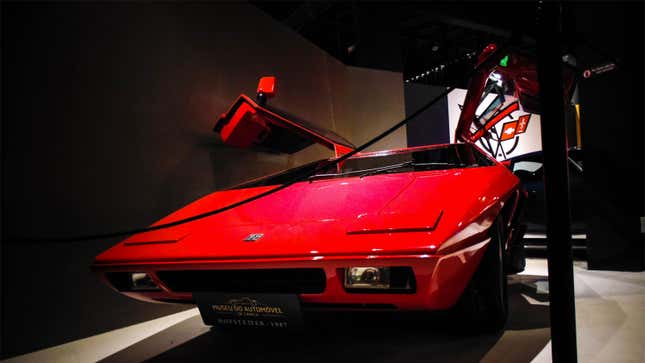 A photo of a red Hofstetter Turbo sports car in a museum. 