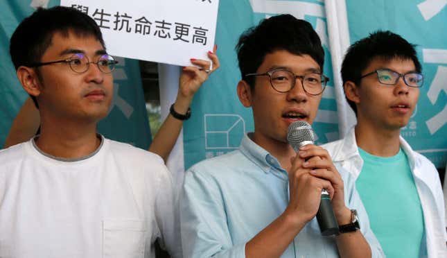 Chow, Law, and Wong (L-R) in 2016.