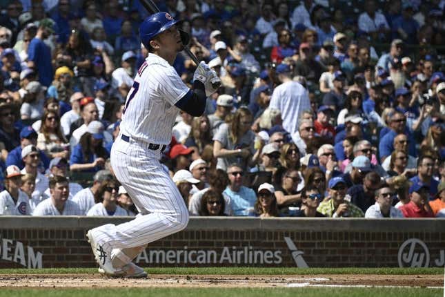 Sep 10, 2023; Chicago, Illinois, USA;  Chicago Cubs right fielder Seiya Suzuki (27) hits an RBI double against the Arizona Diamondbacks during the first inning at Wrigley Field.