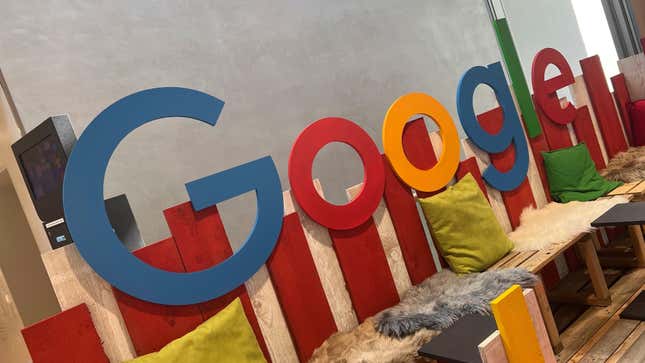 Seating opportunity with Google Logo, company emblem, company logo, with faux fur cushions and pillows.