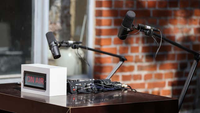A photo of two microphones in a podcast studio. 