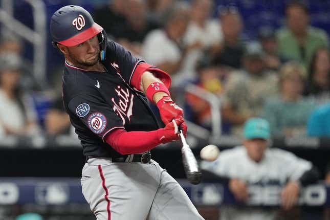Aug 25, 2023; Miami, Florida, USA; Washington Nationals third baseman Carter Kieboom (8) hits a two-run home run against the Miami Marlins in the sixth inning at loanDepot Park.