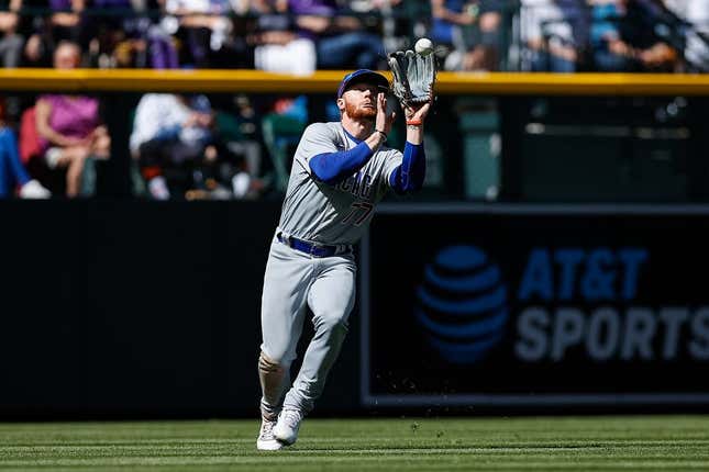 Apr 17, 2022; Denver, Colorado, USA; Chicago Cubs left fielder Clint Frazier (77) makes a catch for an out in the fifth inning against the Colorado Rockies at Coors Field.