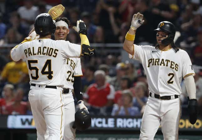 Aug 21, 2023; Pittsburgh, Pennsylvania, USA;  Pittsburgh Pirates right fielder Joshua Palacios (54) celebrates his  three run home run with catcher Endy Rodriguez (25) and  first baseman Connor Joe (2) against the St. Louis Cardinals during the fourth inning at PNC Park.
