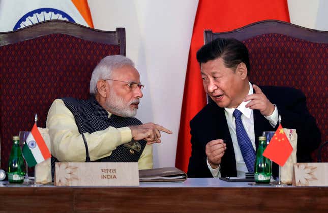 Narendra Modi with Xi Jinping at the BRICS summit in Goa, India.
