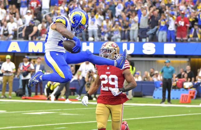 Sep 17, 2023; Inglewood, California, USA; Los Angeles Rams running back Kyren Williams (23) hurdles into the end zone for a touchdown at San Francisco 49ers defensive tackle Javon Kinlaw (99) looks on in the first half at SoFi Stadium.