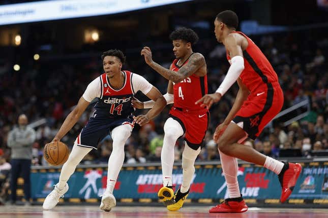 Apr 9, 2023; Washington, District of Columbia, USA;Washington Wizards forward Isaiah Todd (14) dribbles the ball as Houston Rockets guard Jalen Green (4) defends in the third quarter at Capital One Arena.
