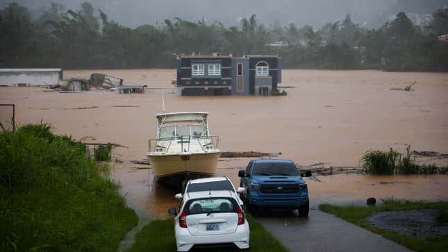 A home is submerged in floodwaters caused by Hurricane Fiona in Cayey, Puerto Rico, on Sunday, September. 18, 2022. According to authorities three people were inside the home and were reported to have been rescued. 