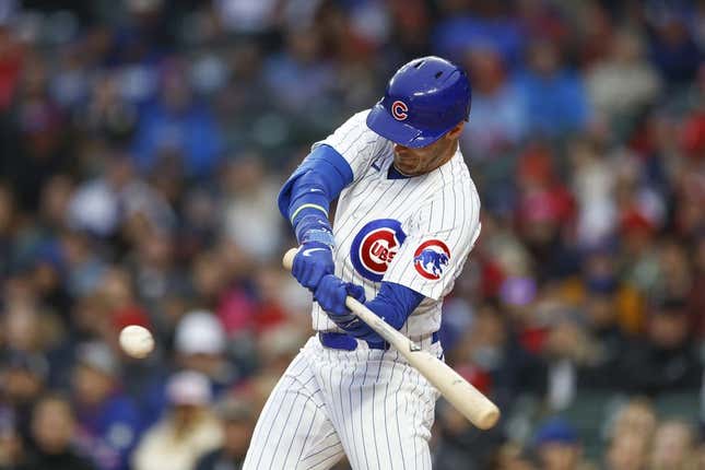 May 8, 2023; Chicago, Illinois, USA; Chicago Cubs center fielder Cody Bellinger (24) singles against the St. Louis Cardinals during the first inning at Wrigley Field.