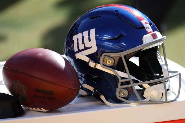 Nov 8, 2020; Landover, Maryland, USA; A view of the helmet of New York Giants kicker Graham Gano (not pictured) next to a ball on the sidelines against the Washington Football Team at FedExField.