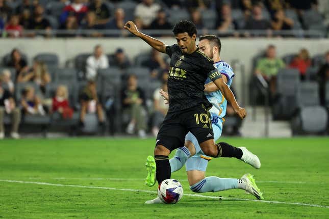 Aug 23, 2023; Los Angeles, California, USA;  Los Angeles FC forward Carlos Vela (10) scores a goal during the first half against the Colorado Rapids at BMO Stadium.