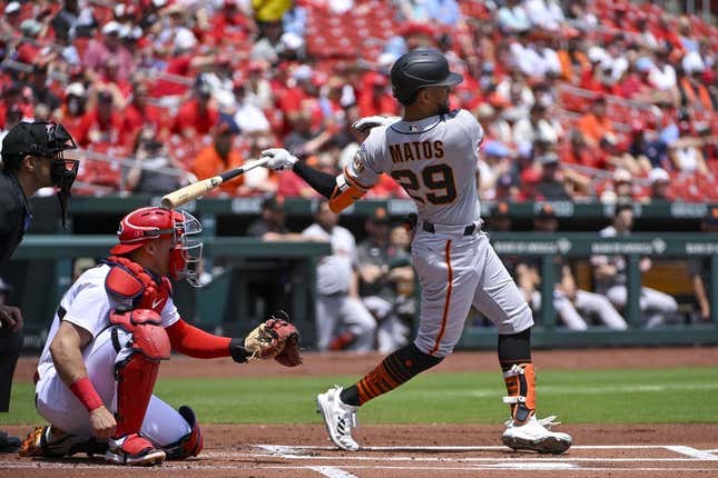 Jun 14, 2023; St. Louis, Missouri, USA;  San Francisco Giants center fielder Luis Matos (29) hits a single in his Major League debut against the St. Louis Cardinals during the first inning at Busch Stadium.