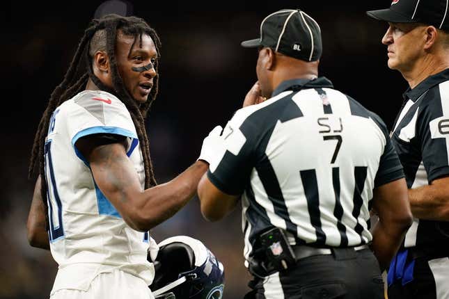 Sep 10, 2023; New Orleans, LA, USA; Tennessee Titans wide receiver DeAndre Hopkins (10) disputes a call with side judge Keith Washington (7) in the second quarter against the New Orleans Saints at Caesars Superdome.