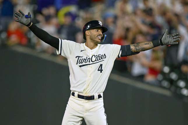 Jul 24, 2023; Minneapolis, Minnesota, USA; Minnesota Twins infielder Carlos Correa (4) celebrates his walk-off RBI single against the Seattle Mariners during the tenth inning at Target Field.