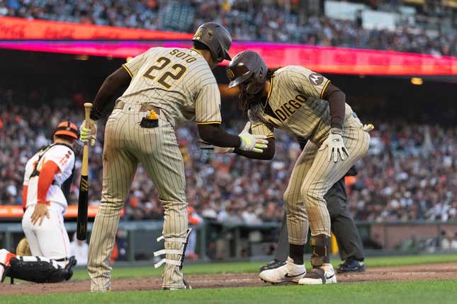 Jun 20, 2023; San Francisco, California, USA;  San Diego Padres left fielder Juan Soto (22) celebrates with right fielder Fernando Tatis Jr. (23) after hitting a home run during the fifth inning against the San Francisco Giants at Oracle Park.