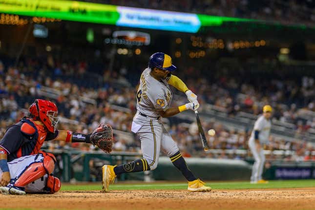 Jul 31, 2023; Washington, District of Columbia, USA; Milwaukee Brewers third baseman Andruw Monasterio (14) hits a single during the sixth inning against the Washington Nationals at Nationals Park.