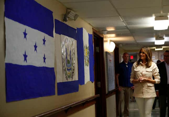 Flag from central American countries hang from the walls at the center for migrant children.