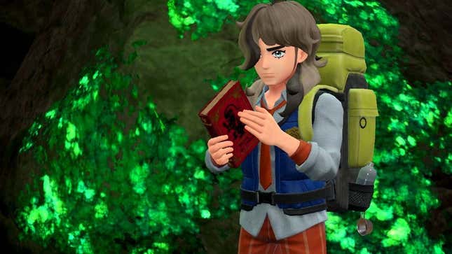 A Pokemon trainer looks at an ancient book.