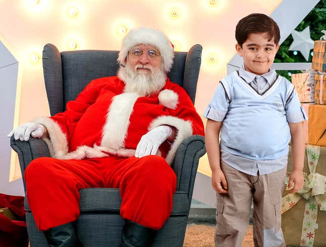Image for article titled Husky Boy Relegated To Standing Next To Santa